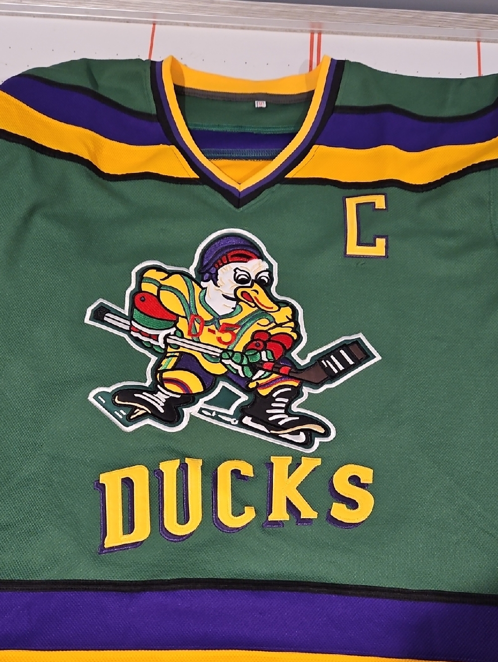 Source Unknown MIGHTY Ducks Hockey Jersey with Yellow and Purple Accents